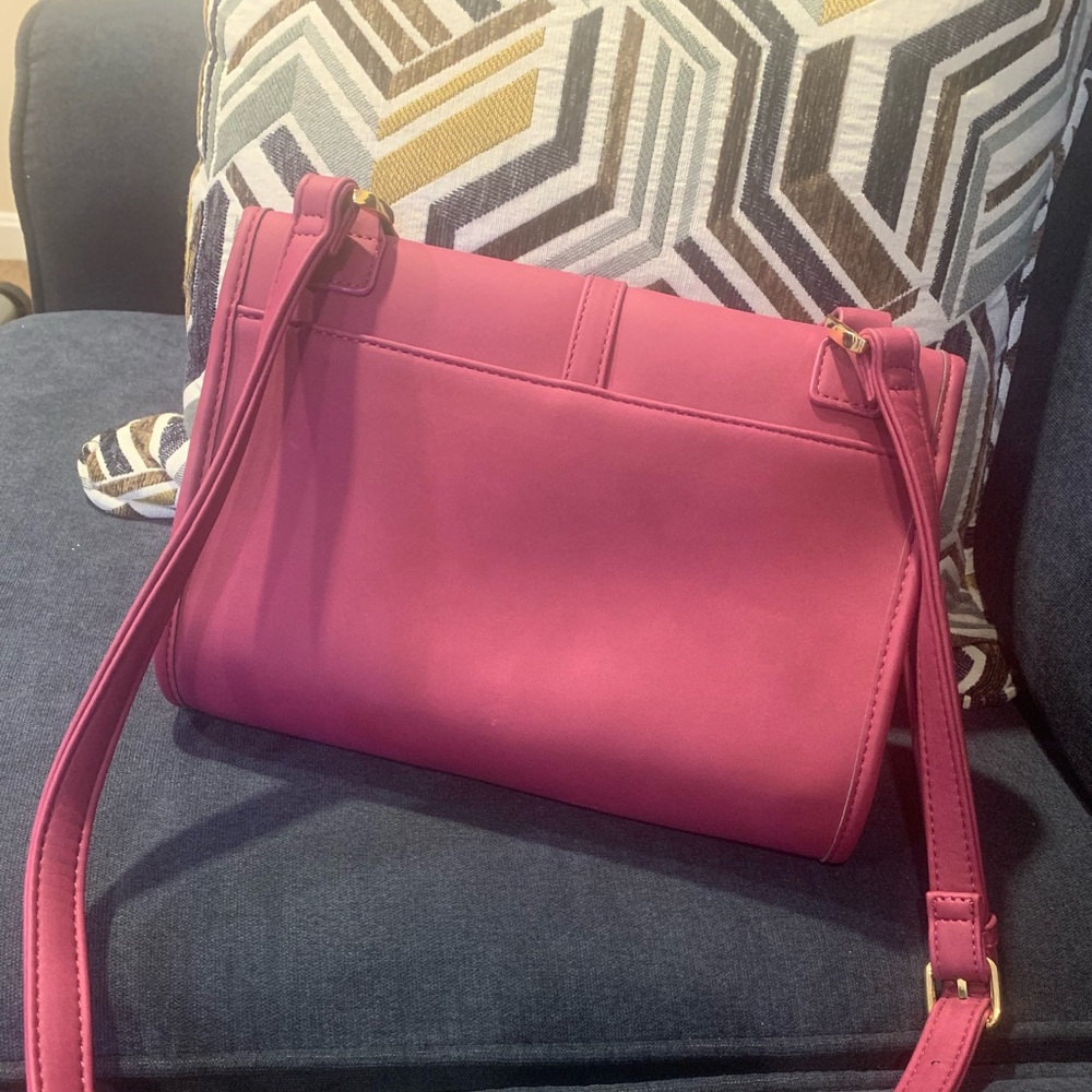 This bag is Fushia with inside zipper.Smooth fabric .